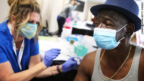 Larry Green receives a Band-Aid from registered nurse Teresa Frey after he received his second dose of the Moderna Covid-19 vaccine at Lincoln Memorial Congregational Church UCC last month in Los Angeles.