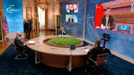 Chinese President Xi Jinping, right (on screen), attending the virtual climate summit with other world leaders on April 22. 