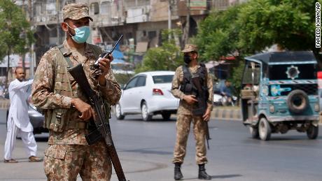 Army troops help enforce new Covid-19 restrictions in Karachi, Pakistan, on April 27.
