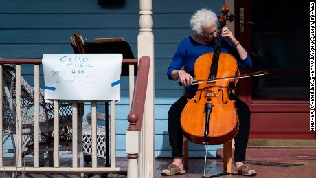 Cellist Jodi Beder plays on her front porch in Mount Rainier, Maryland. You can learn an instrument, too.