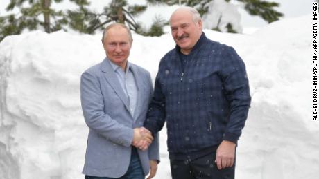 Russian President Vladimir Putin (L) shakes hands with Belarus President Alexander Lukashenko during their meeting in Sochi on February 22, 2021.