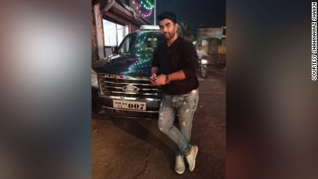 Shahnawaz Shaikh in his SUV, circa 2019, which he later sold to raise funds for his humanitarian work, providing free oxygen to those who couldn't find or afford it.