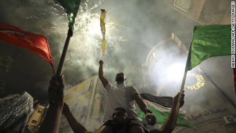 Palestinians celebrate in the West Bank city of Ramallah on Friday, after the ceasefire was agreed.