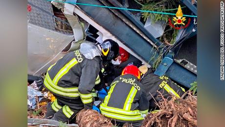 Rescuers work at the crash site.