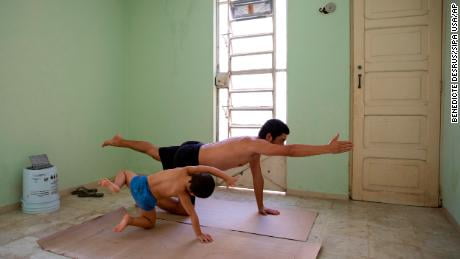 Photographer Bénédicte Desrus and his son Thiago do yoga together during the pandemic in Mérida, Yucatán, Mexico.
