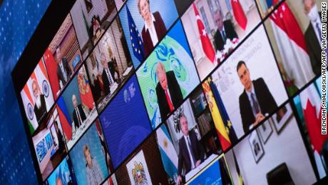 World leaders are seen on a screen during a climate change virtual summit from the East Room of the White House campus April 22, 2021, in Washington, DC