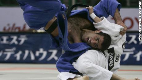 Iran's Vahid Sarlak duels with Spain's Javier Fernandez in the up to and including 60 kgs men's open category during the World Judo Championships in Cairo in September 2005. Sarlak says he was forced to default from the tournament after he'd been drawn against an opponent from Israel.