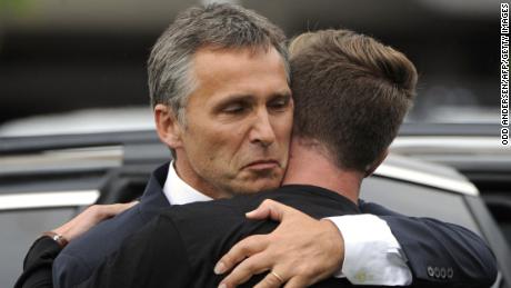 Norway's then-Prime Minister Jens Stoltenberg, left, embraces Eskil Pedersen, leader of the Norwegian Labour Youth league and a survivor of the Utoya attack, on July 23, 2011.