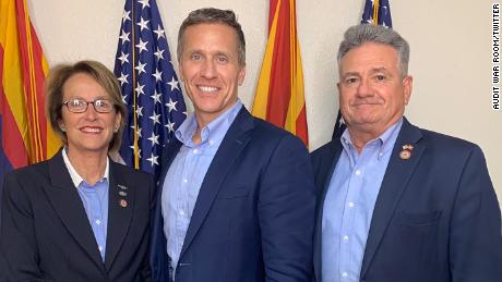 Former Missouri Gov. Eric Greitens, (center) now running for a US Senate seat, poses with Arizona state senators Wendy Rogers and Sonny Borrelli before his June 12 tour of the Arizona Senate's audit site.