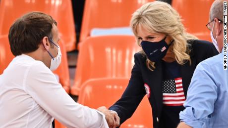 French President Emmanuel Macron and Biden shake hands ahead of the women's first round 3x3 basketball match between the US and France.