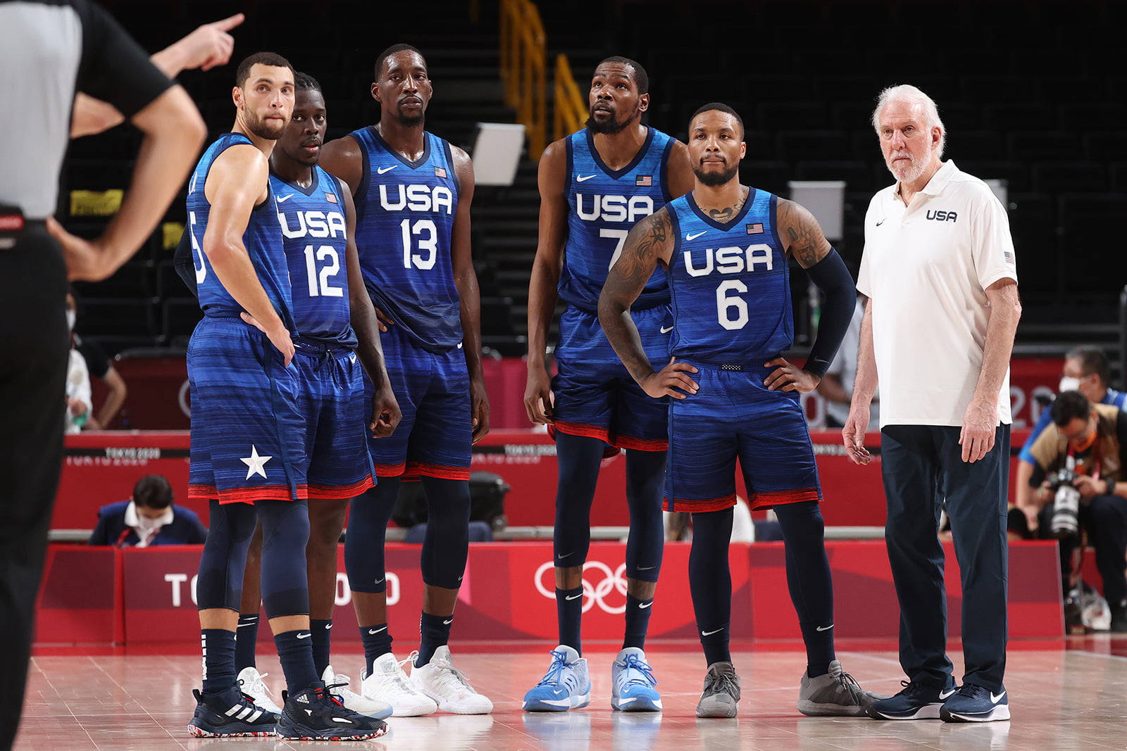Zachary Lavine, Jrue Holiday, Bam Adebayo, Kevin Durant, Damian Lillard and Head Coach Gregg Popovich of Team USA during their game against France on Sunday, July 25. 