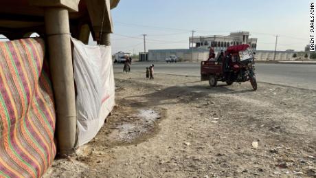 An unfinished construction site is now the site of an informal camp housing around 30 families who have fled the violence. A tuk-tuk delivers new arrivals.