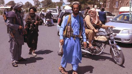 Taliban fighters patrol the streets in Herat on August 14.