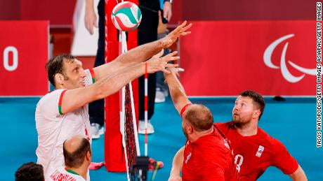 Mehrzad competes at the net against the RPC's Viktor Milenin during the men's sitting volleyball final.