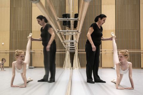 Jana Jodasova, director of the National Theatre Ballet Preparatory School in Prague, Czech Republic, works with Ukrainian children during a ballet lesson organized by the school on Wednesday, April 13.