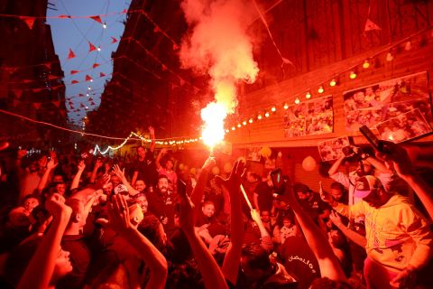People in Cairo celebrate with fireworks during a mass iftar gathering in Cairo on Saturday, April 16. During the Muslim holy month of Ramadan, iftar is the breaking of fast after sundown.