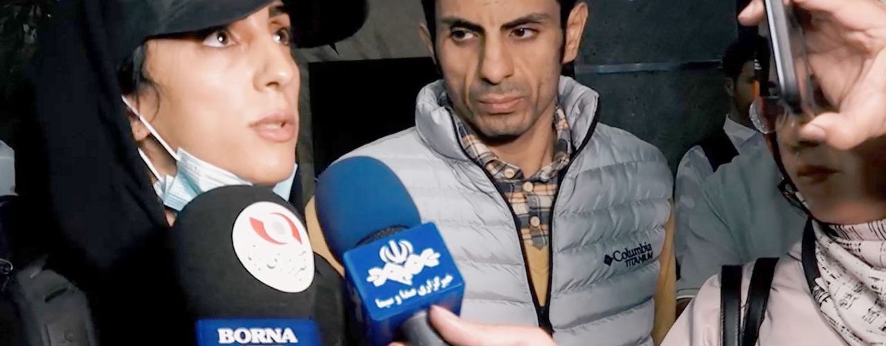 Iranian rock climber arrives back in Tehran after competing without hijab