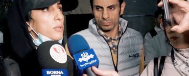 Iranian rock climber arrives back in Tehran after competing without hijab